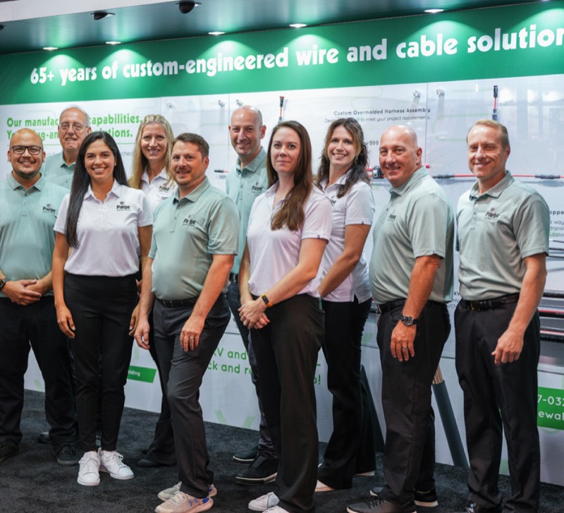 Group shot of Paige representatives at a tradeshow.